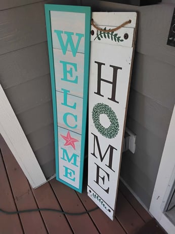 Michelle's Welcome Home signs on front porch.