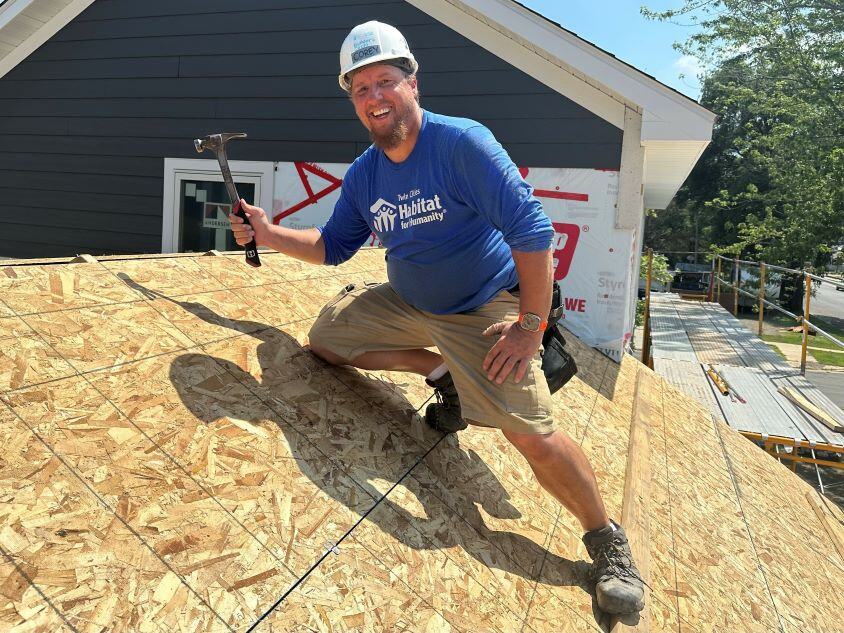 Corey working on a house.