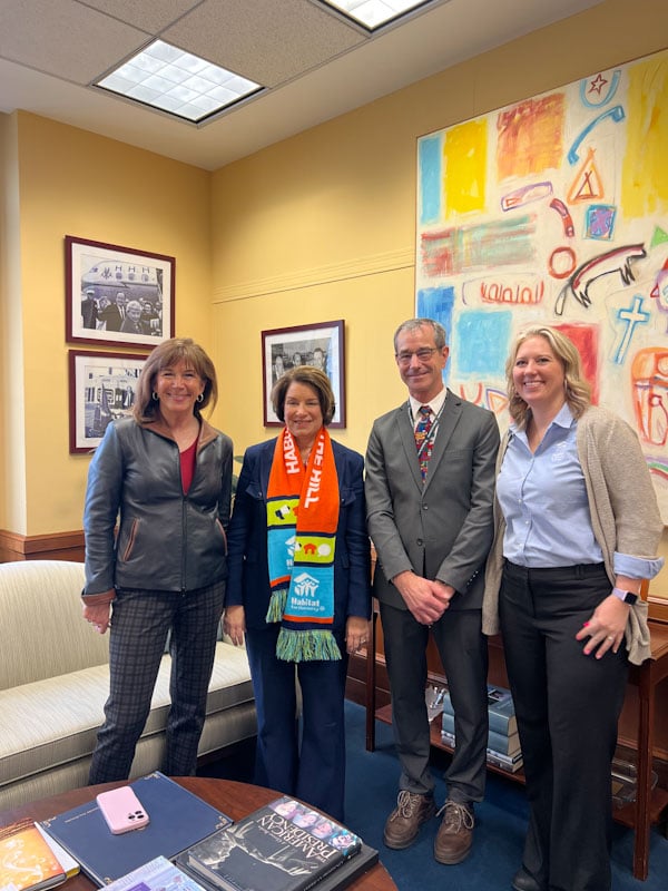 Three Habitat for Humanity advocates meeting with Senator Amy Klobuchar