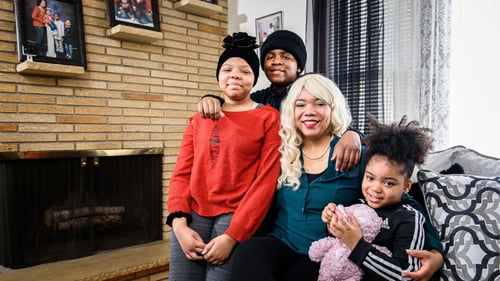 Angels family in front of the fireplace