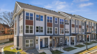 Photo of the Harrison Townhomes on a city street.