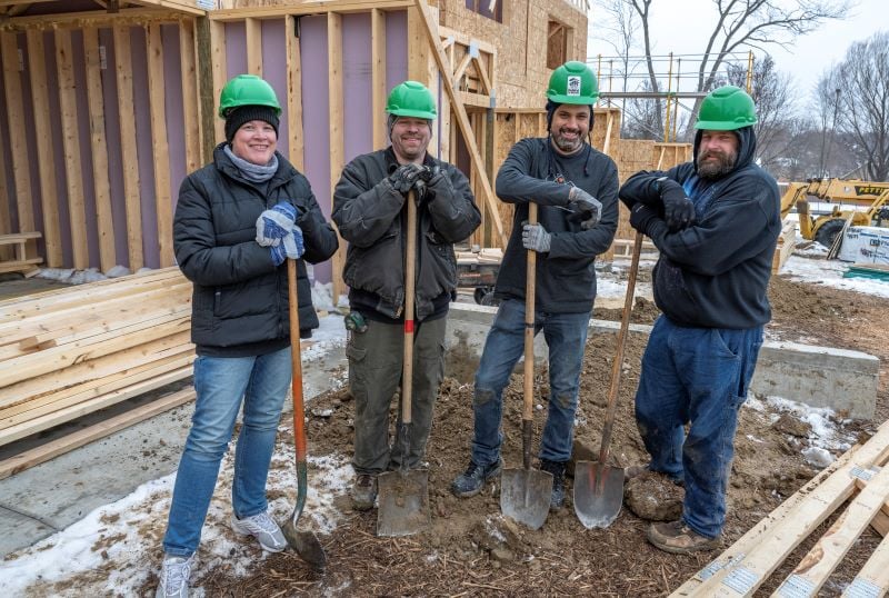 SMSC volunteers holding shovels.