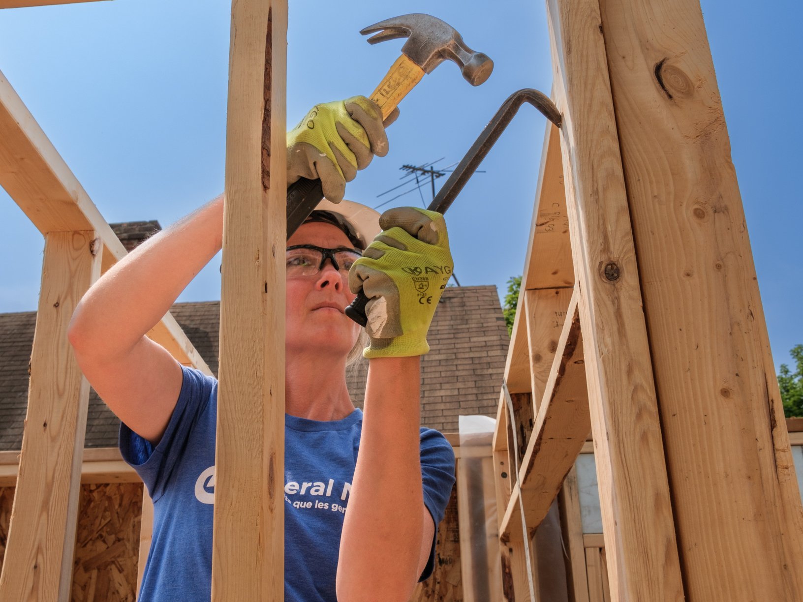 Volunteer using hammer.