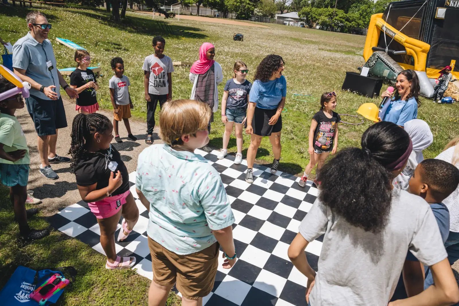 A large group of mostly kids playing a game together