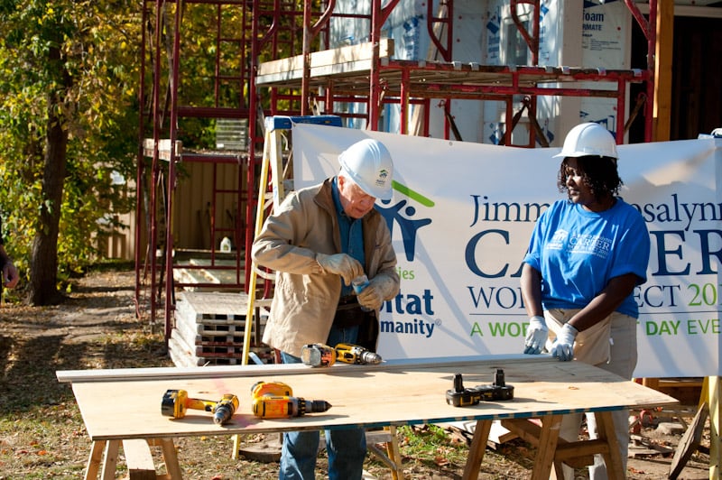 Melo building with Jimmy Carter.