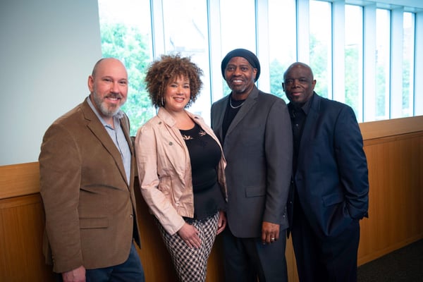 A group photo of Jeffrey Williams with his coworkers at Twin Cities R!SE