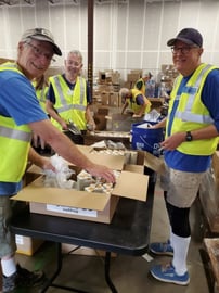 Volunteers at warehouse.