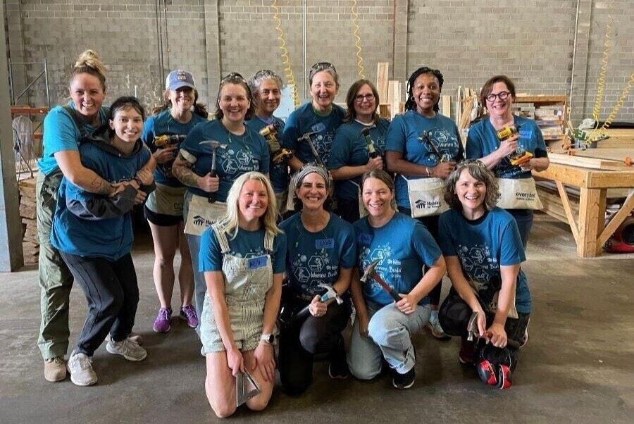 Women build at warehouse.